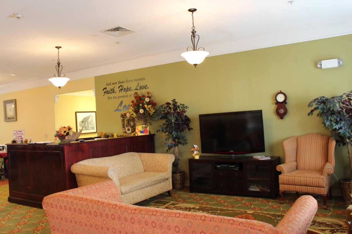 A cozy living room featuring comfortable seating, a television, and tasteful decor.