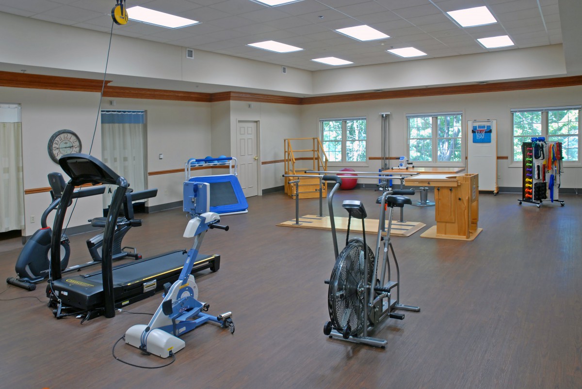 A rehabilitation gym equipped with various exercise machines.