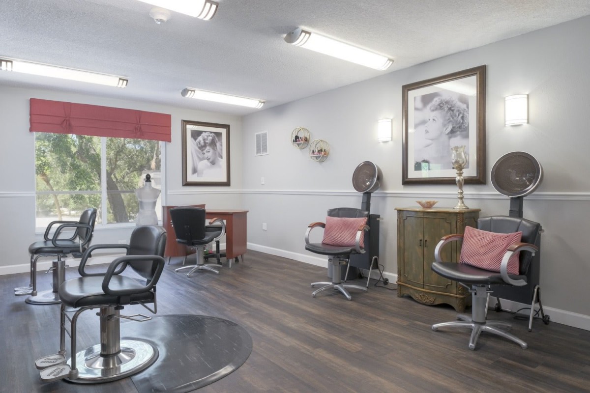 A modern hair salon with comfortable chairs and stylish decor.