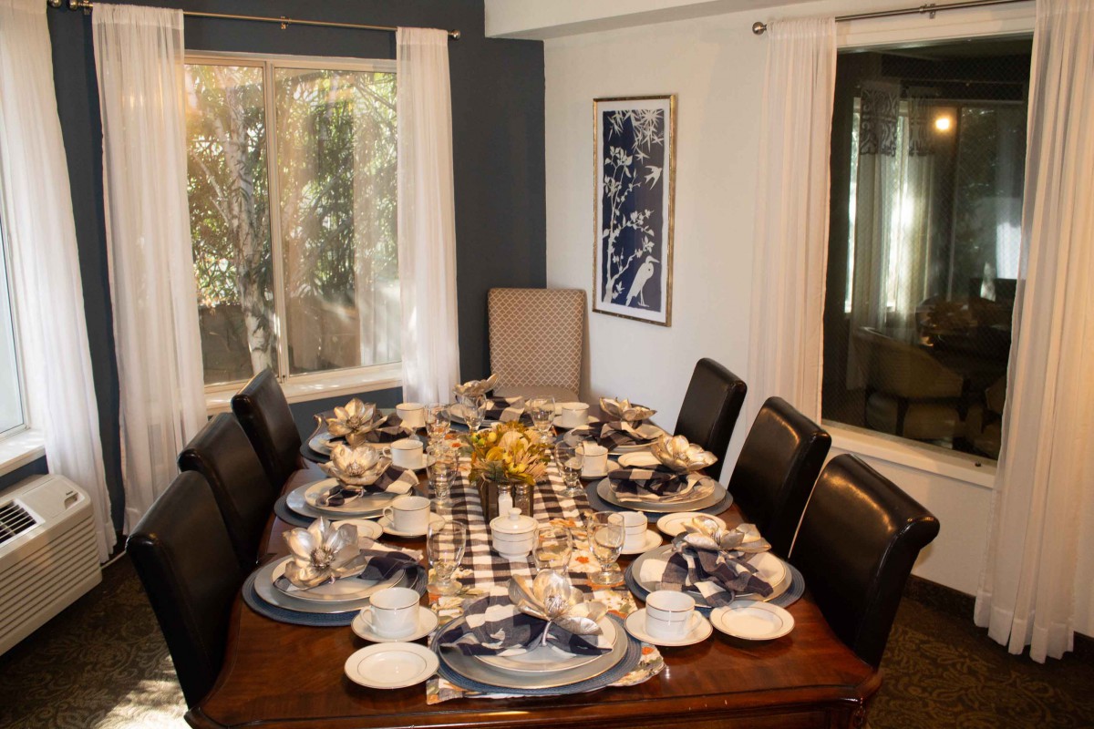 A beautifully set dining table ready for a formal dinner.
