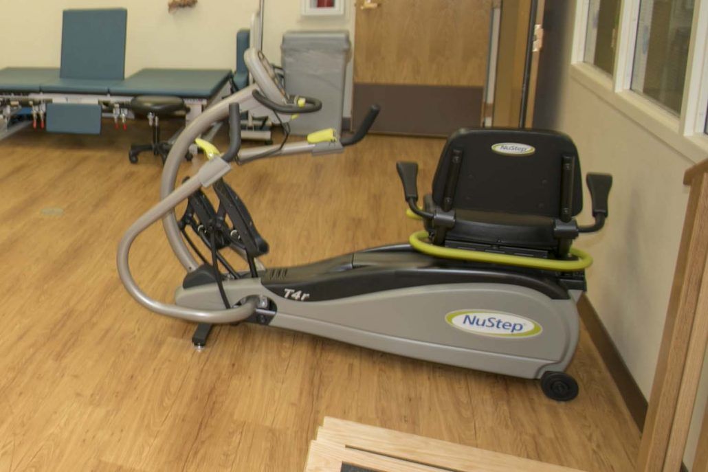 A recumbent cross trainer in a gym or fitness room.