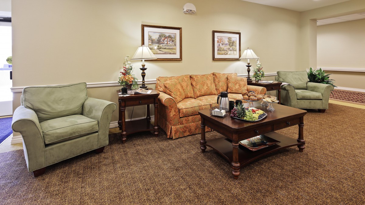 A cozy living room with comfortable seating and warm lighting.