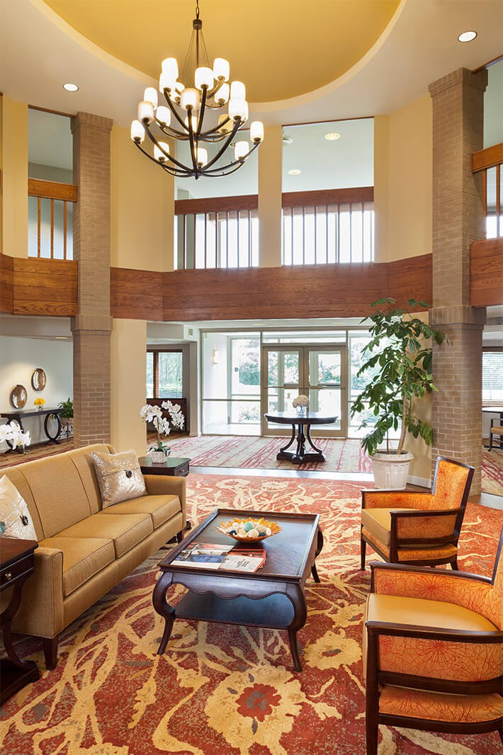 A well-furnished hotel lobby with seating area and modern decor.