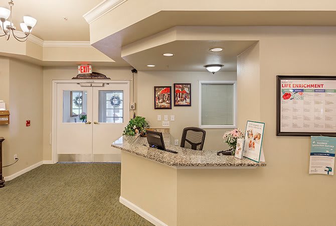 A welcoming office reception area with a desk and comfortable seating.