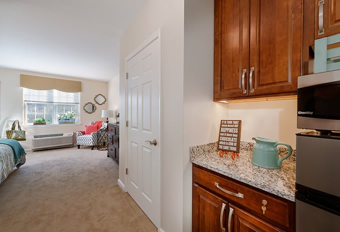 A cozy home interior with a view of the kitchen and living room area.