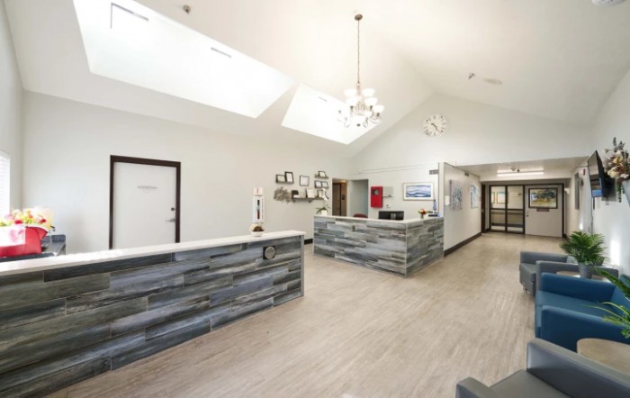 A modern reception area with sleek wood accents and skylights.