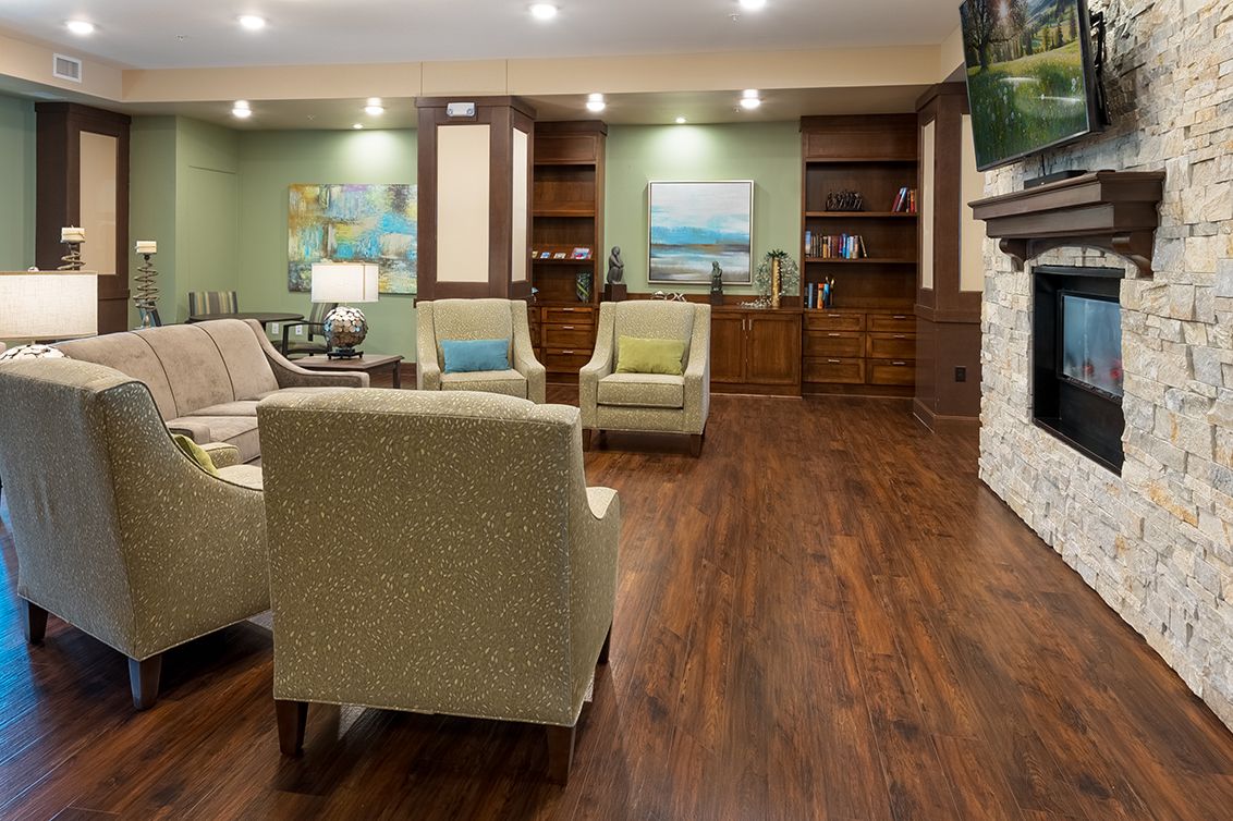 A modern living room with comfortable seating, wood flooring, and tasteful decor.