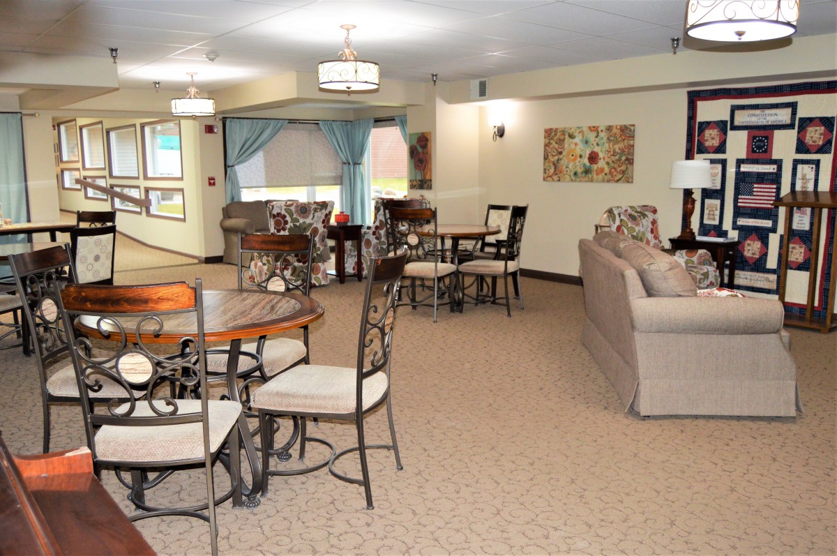 A spacious living room with modern decor and a dining area.