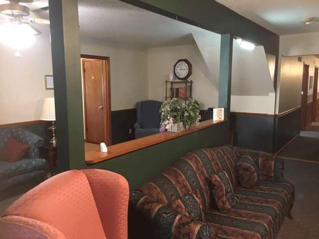 A cozy lobby area with comfortable seating and decorative elements.