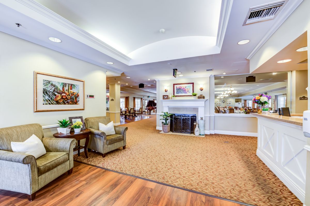 A cozy and spacious living area with comfortable seating and a fireplace.