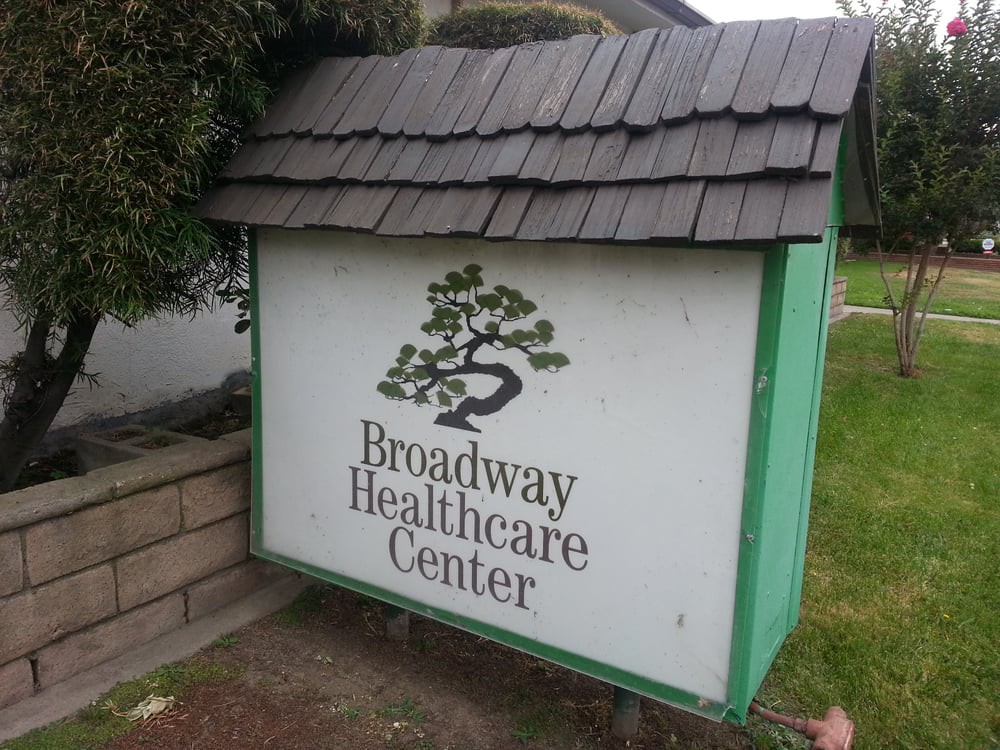 Sign for Broadway Healthcare Center in an outdoor setting.