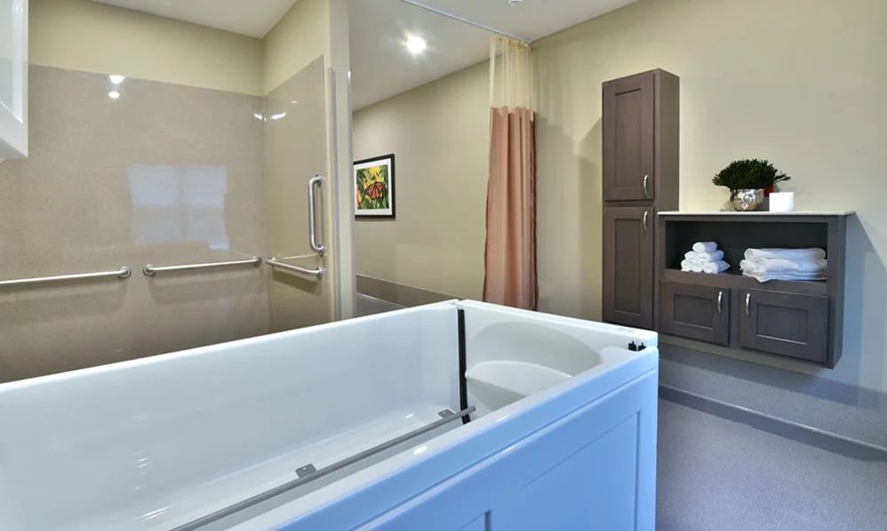 A modern and luxurious bathroom with a large bathtub and sleek design.