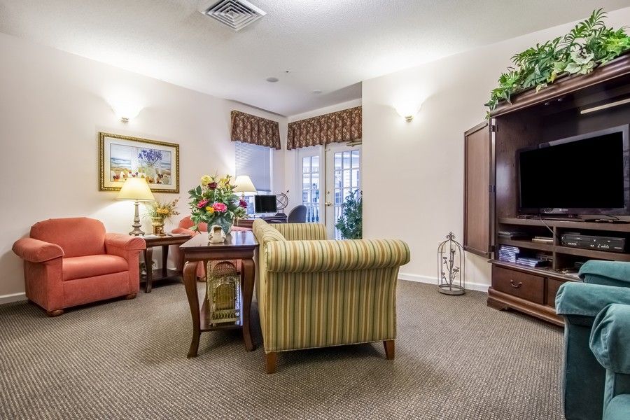 A cozy living room with comfortable furniture and warm lighting.