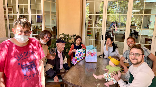 A joyful family gathering celebrating a special occasion with laughter and love.