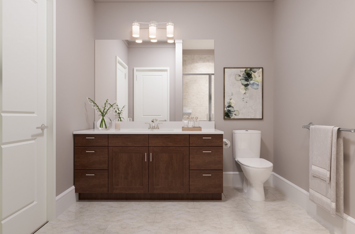 A modern bathroom featuring a wooden vanity with a large mirror, contemporary lighting, and minimalistic decor.