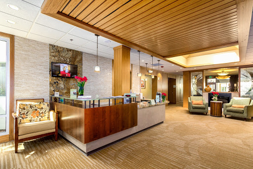 A welcoming and modern lobby reception area with wooden accents and soft lighting.