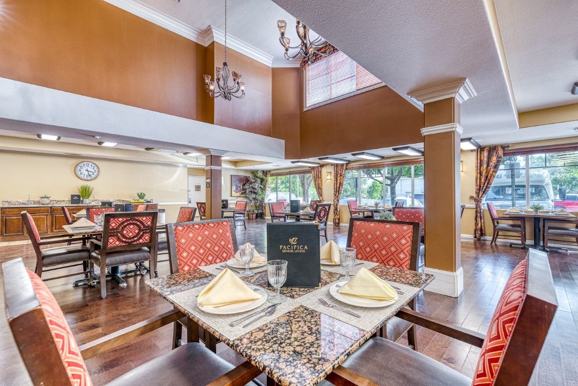 An elegant restaurant dining area with lavish decor and table settings.