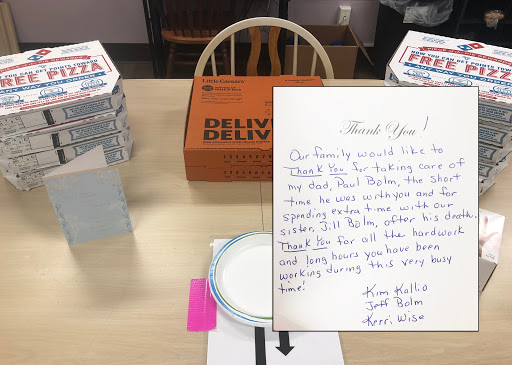 A heartfelt thank you note accompanied by pizza, reflecting gratitude and appreciation.