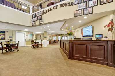 Lobby area with a Hall of Honor display and reception desk.