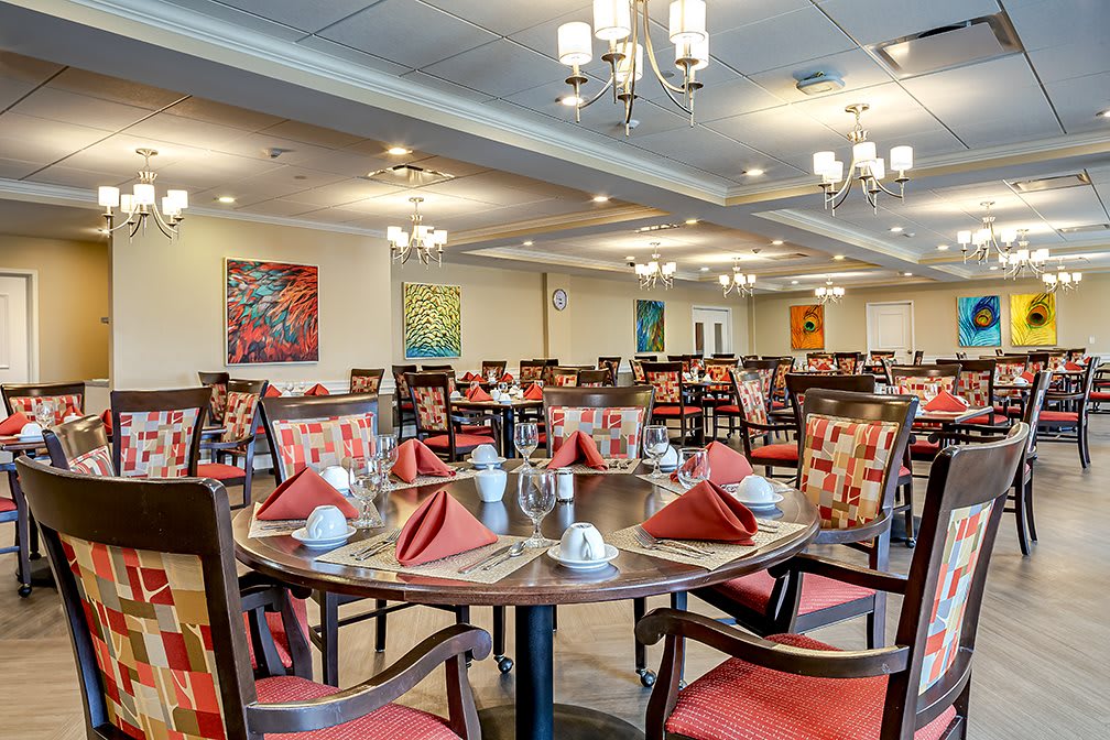 A spacious dining area with neatly arranged tables and vibrant dcor.