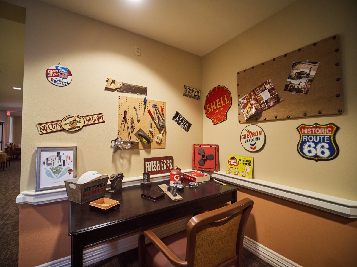 A cozy office space with vintage decor and retro wall art.