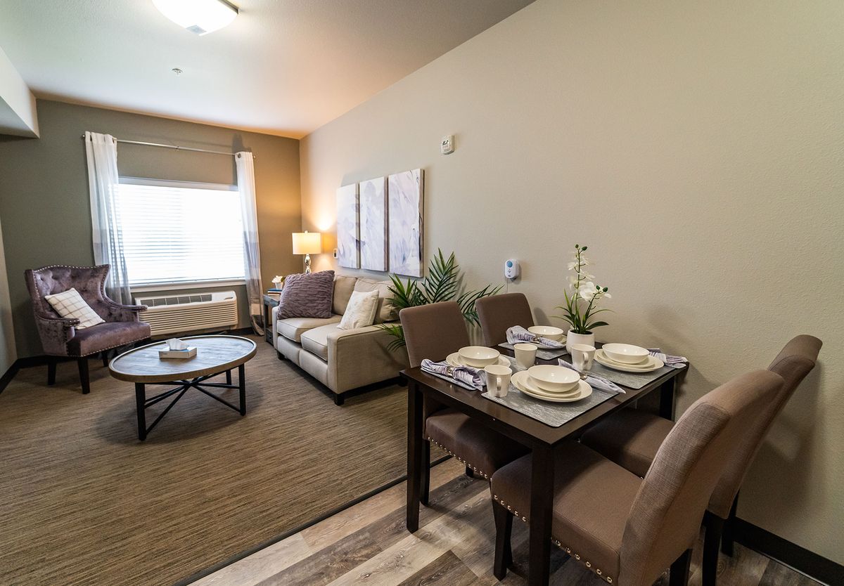 A modern apartment with a cozy living room and dining area.