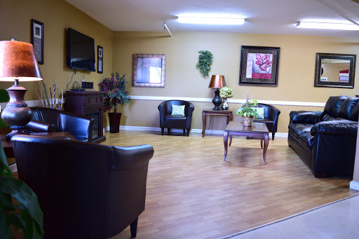 A cozy living room space featuring comfortable seating and decorative elements.