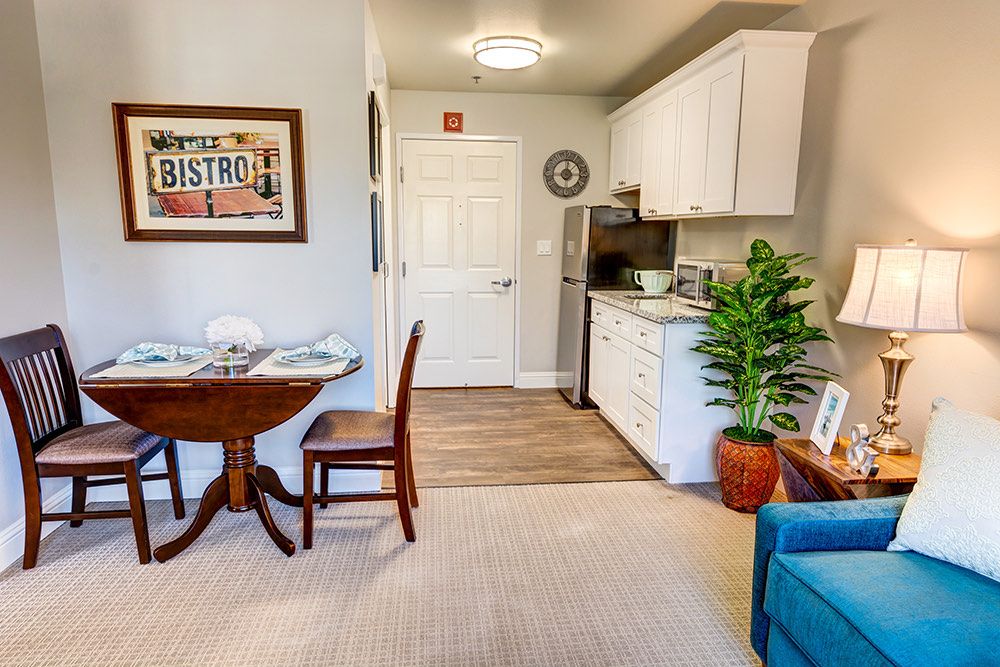 A cozy apartment kitchen and dining area with stylish decor.
