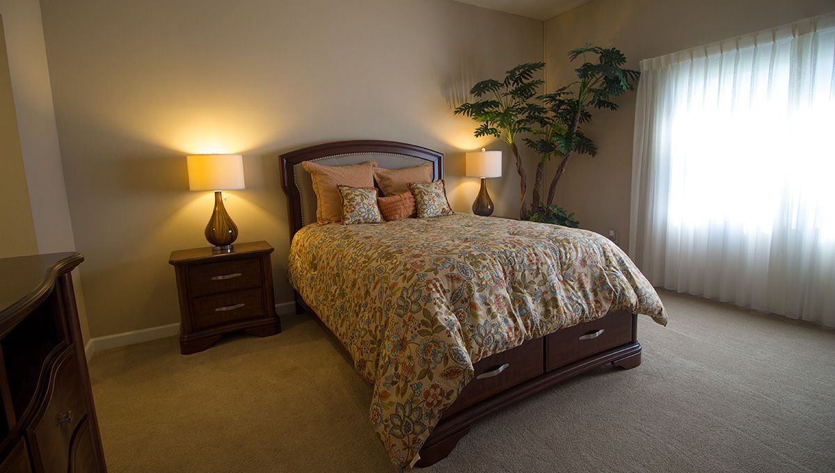 Cozy bedroom with warm lighting and inviting decor.