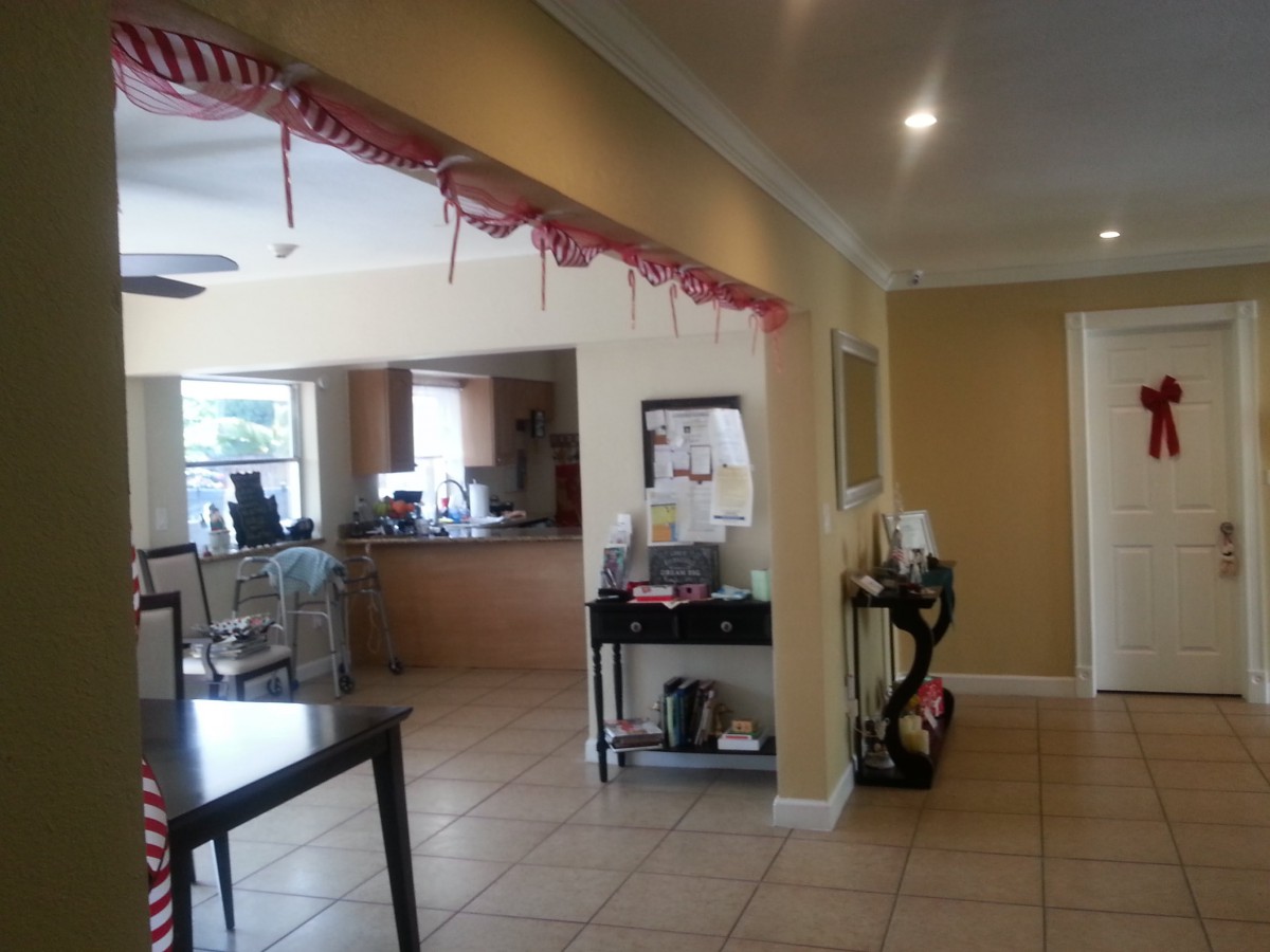 Open kitchen and dining area with festive decorations.
