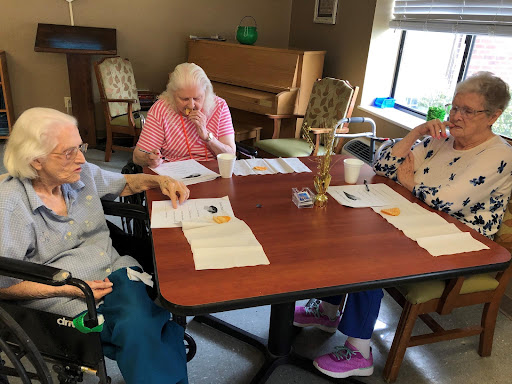 Seniors engaged in a group activity at their community center.