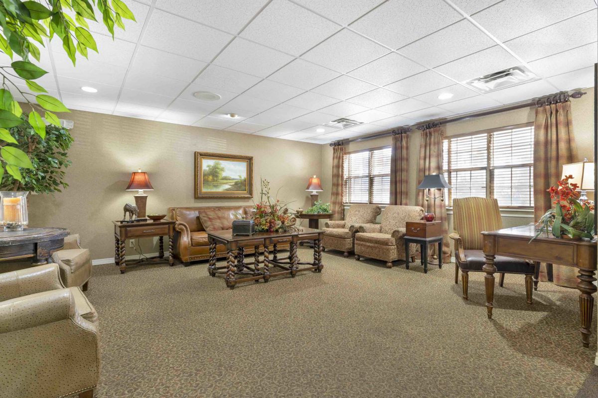 A cozy living room with comfortable seating and warm lighting.