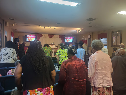 A community gathering in worship at a local church.