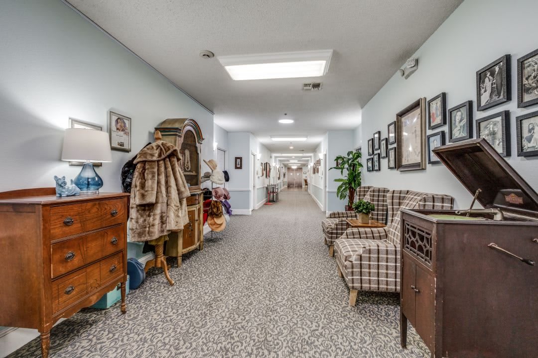 A cozy hallway with furniture and decorative elements, showcasing a warm interior design.