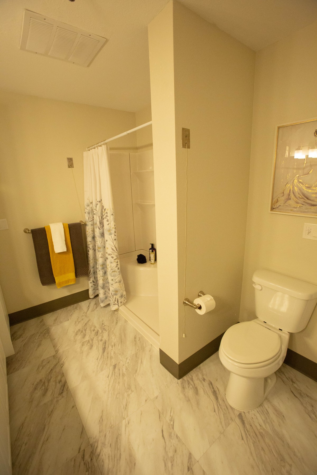 A clean and well-lit bathroom with modern fixtures.