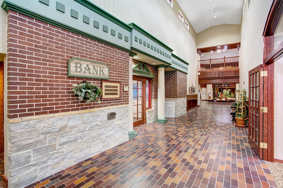 A bank interior featuring brick walls and a distinct architectural design.