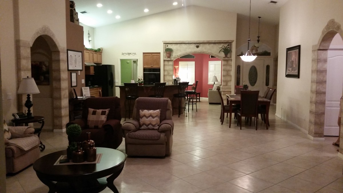 Spacious open floor plan featuring a cozy living room, modern kitchen, and elegant dining area.