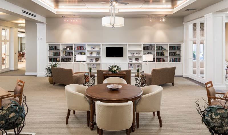 A cozy reading area with bookshelves and comfortable seating.