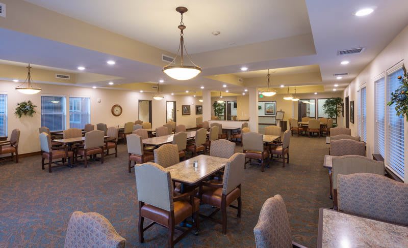 Spacious dining area with neatly arranged tables and chairs.
