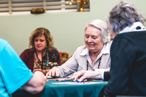 A lively group of seniors enjoying a game of bingo together.