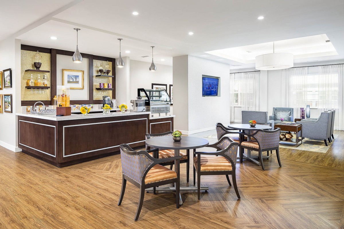 A modern caf interior with stylish furniture and elegant lighting.
