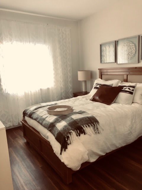 A cozy bedroom with soft lighting and elegant decor.