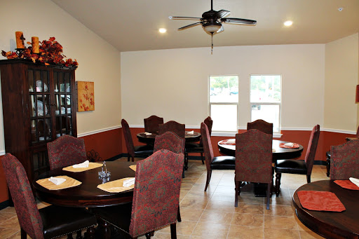 A cozy dining room featuring elegant furniture and ample natural light.