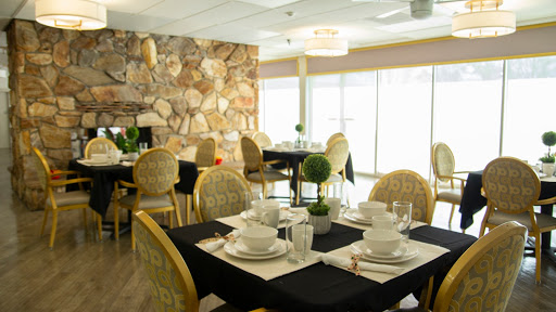 An elegant dining area featuring carefully arranged tables and stylish decor.