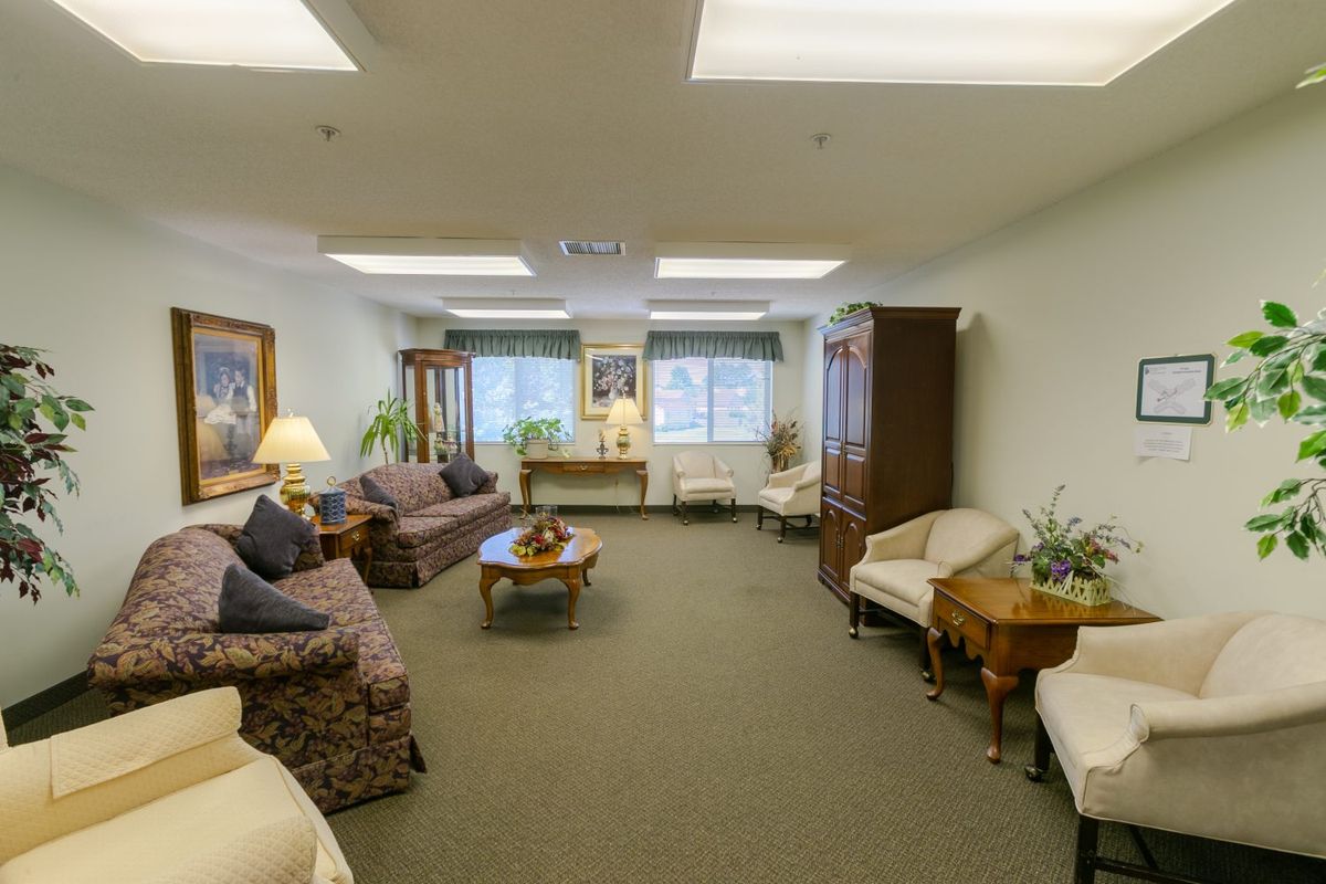 A spacious living room with comfortable seating and elegant decor.