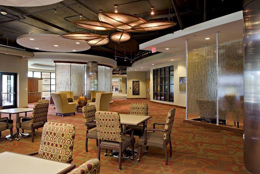 A modern lobby featuring comfortable seating and stylish lighting.