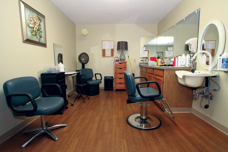 A well-equipped hair salon with multiple styling stations and chairs.