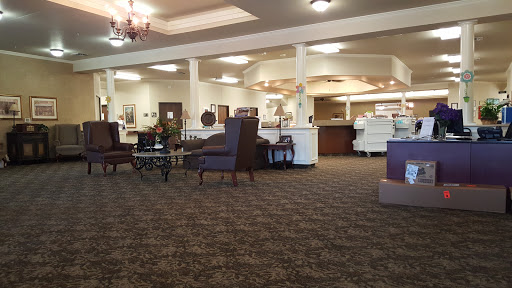 A spacious lobby area with comfortable seating and a welcoming reception desk.