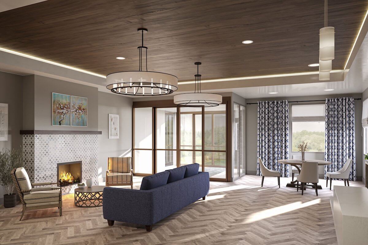 A modern living room featuring a blue sofa, fireplace, and large windows with stylish chandeliers and wooden ceiling.
