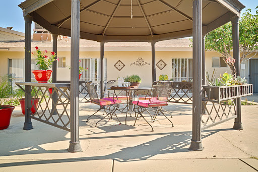 A cozy outdoor gazebo seating area, perfect for relaxation and social gatherings.